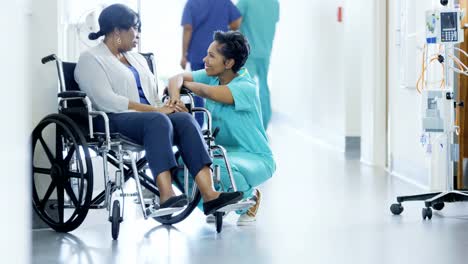 Multi-ethnic-team-with-senior-patient-in-wheelchair