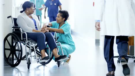 African-American-female-nurse-and-disabled-patient-consult