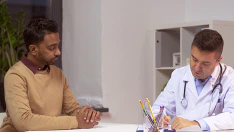 doctor-and-male-patient-talking-at-hospital