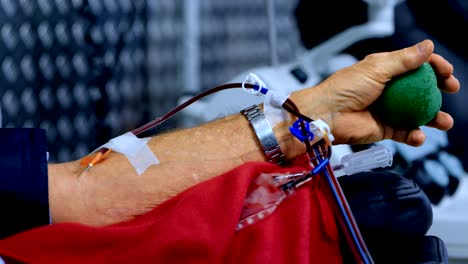 Senior-man-donating-blood-in-blood-bank-4k