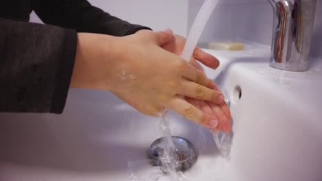 Child-washing-hands-with-soap