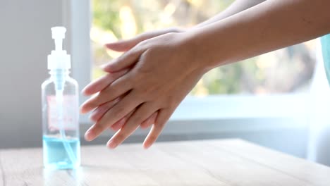 Woman-using-alcohol-gel-to-washing-hands-to-prevention-virus-and-bacteria,-hand-sanitizer-gel-for-cleaning-hands-,prevent-coronavirus-Covid-19,---health-care-Concept.