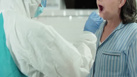 Laboratory-worker-taking-pcr-test,-putting-sample-swab-in-tube,-coronavirus