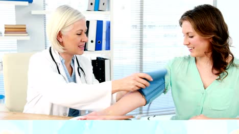 Female-doctor-checking-blood-pressure-of-a-patient