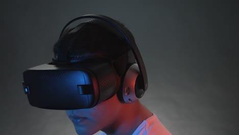 Young-Man-Wearing-VR-Headset-And-Experiencing-Virtual-Reality