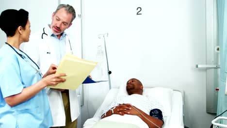 Doctor-and-nurse-interacting-with-patient