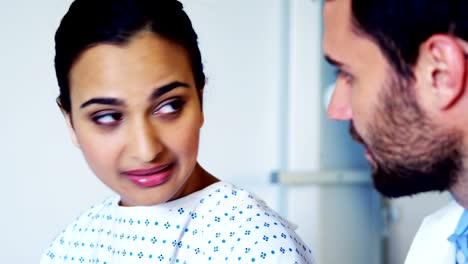 Doctor-examining-patients-ear-with-otoscope