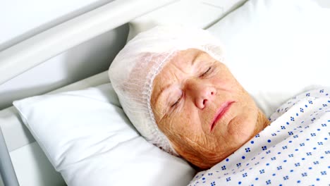 Senior-woman-patient-sleeping-on-bed