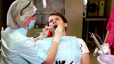 Doctor-dentist-performs-a-primary-examination-of-the-oral-cavity-of-the-patient