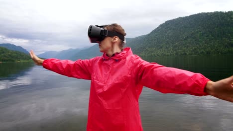 The-girl-in-the-red-jacket-is-standing-on-the-pier-In-virtual-reality-glasses