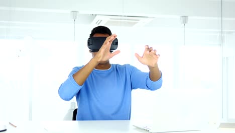 Man-wearing-virtual-reality-glasses-in-Office.-using-with-Smartphone-VR-goggl