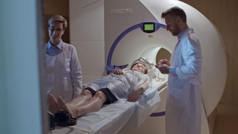 Medical-Technicians-Preparing-Patient-for-MRI-Scan