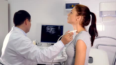 Close-up-of-the-doctor--making-the-ultrasound-examination-of-the-larynx