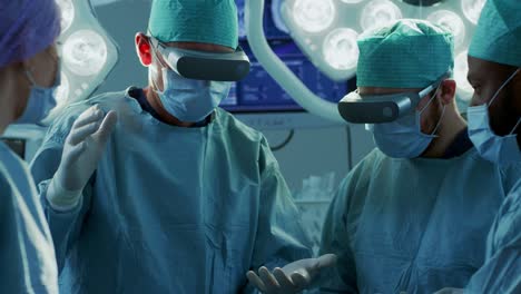 Surgeons-Wearing-Augmented-Reality-Glasses-Perform-State-of-the-Art-Augmented-Reality-Surgery-in-High-Tech-Hospital.-Doctors-and-Assistants-Working-in-Operating-Room.