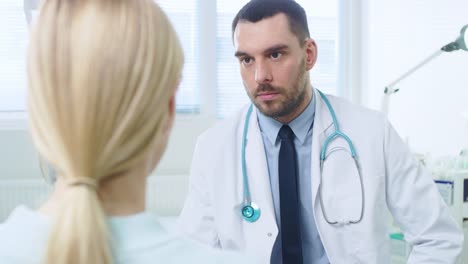 Over-the-Shoulder-Shot-of-a-Female-Patient-Listening-to-a-Medical-Doctor.