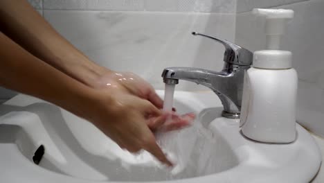 Washing-hand-with-soap-and-water