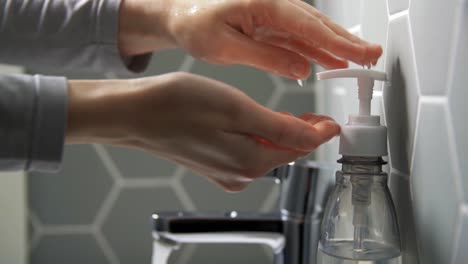 close-up-of-woman-washing-hands-with-liquid-soap