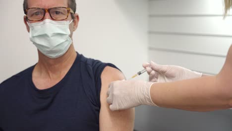 a-male-patient-receives-a-vaccination