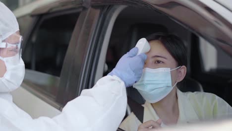 Doctor-officer-test-coronavirus-or-Covid-19-at-the-people-drive-Thru