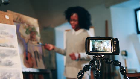 Art-lesson-of-an-african-lady-is-being-filmed-on-a-camera