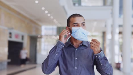 Satisfied-immunized-man-removing-his-face-mask-after-vaccination