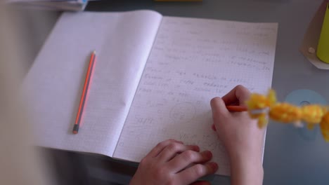 Girl-writing-homework-at-home