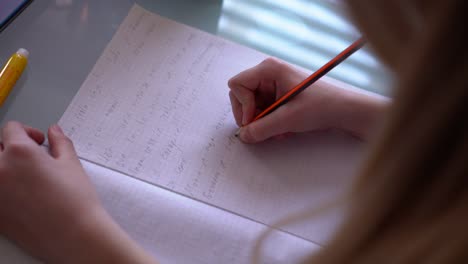 Girl-writing-homework-at-home