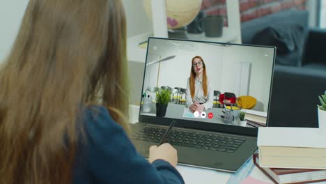 Distance-teacher-online-tutor-conferencing-on-laptop-communicate-with-pupil-by-webcam-video-call-e-learning.-Home-quarantine-distance-learning-and-working-at-home.