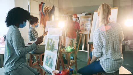 Creative-hobby,-artwork-creature-concept.-Group-of-women-in-face-masks-are-having-a-painting-lesson