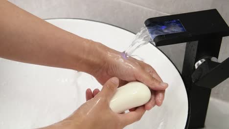 Slow-motion-video-of-woman-washing-hands-with-a-soap