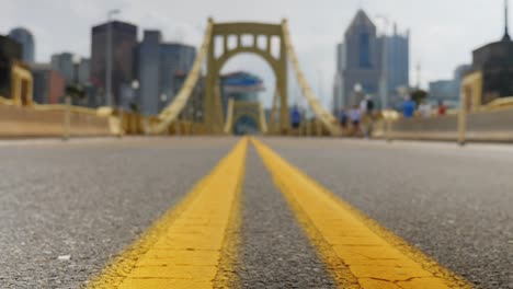 Slow-Dolly-Tracking-Shot-of-6th-Street-Bridge-and-Pittsburgh-Skyline