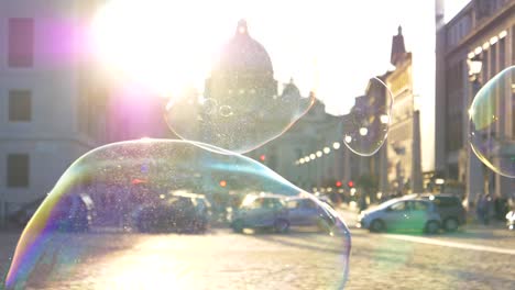 LENS-FLARE:-Colorful-soap-bubbles-fly-around-the-sunlit-square-in-Vatican-City.