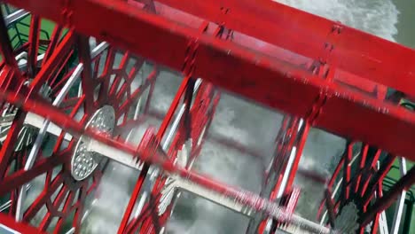 Paddle-Wheel-Of-Steamboat-On-Mississippi-River-Trail-On-Waters