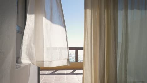 White-Curtains-at-an-Oceanfront-Resort-Blowing-in-a-Summer-Breeze---Slow-Motion