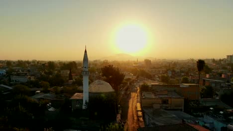 Flight-above-Muslim-town-with-mosque-minaret-and-residential-buildings.