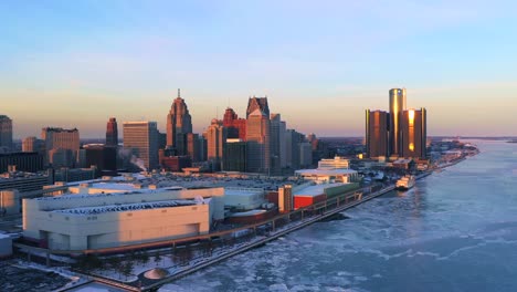 Frozen-Detroit-river-Renaissance-center-aerial-view-Winter-at-Sunset