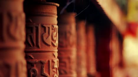 Spinning-prayer-wheels-at-the-Nyingma-monastery-in-Marpha,-Mustang,-Nepal