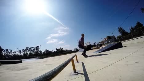 Skateboarder-grinding-down-rail