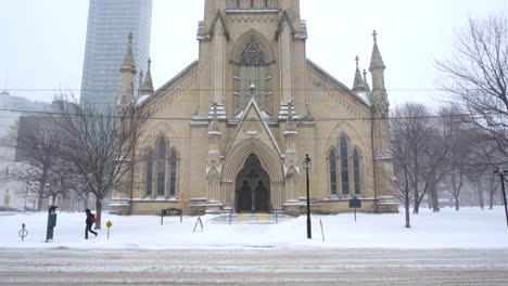 Panning-up-to-the-tip-top-of-a-downtown-church.