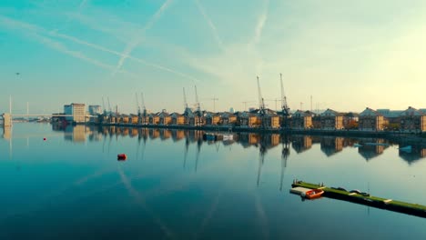 Aerial-view-of-East-London-docklands-and-the-Thames-on-a-day-of-a-clear-blue-sky