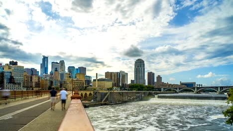 Puente-de-arco-de-piedra-de-Minneapolis-horizonte-tiempo-lapso-Logos-quitado-4K-1080p