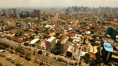 Luftbild-Stadt-mit-Wolkenkratzern-und-Gebäuden.-Philippinen,-Manila,-Makati