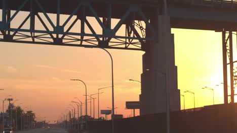 CLOSE-UP:-Driving-through-the-industrial-zone-in-Detroit-city-at-golden-sunset