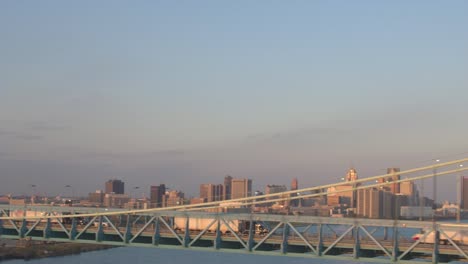 AERIAL-Semi-trucks-crossing-highway-bridge-transporting-goods-from-USA-to-Canada