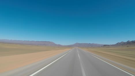 Seamless-looping-motion-blure-POV-driving-shot-on-an-empty-road