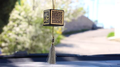 Religious-Islamic-symbol-on-the-mirror-of-the-car