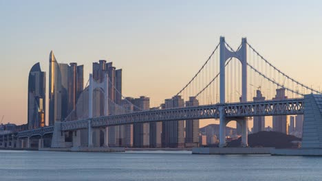 Timelapse-of-Gwangan-Bridge-and-Haeundae-at-Sunset,-Busan-City,-South-Korea.Timelapse-4k