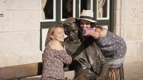 Tourist-Girls-Taking-Selfie-Near-Statue-In-Habana-Cuba