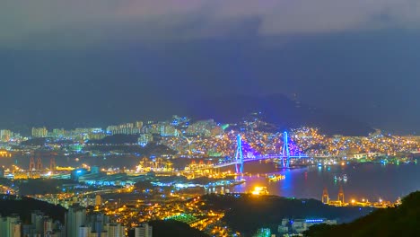 4K,-Zeitraffer-Ansicht-von-Busan-in-der-Nacht-mit-einer-Brücke-aus-Südkorea
