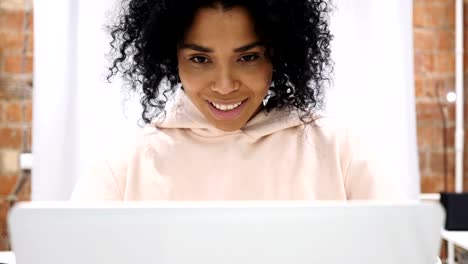 Portrait-of-Smiling-Positive-Afro-American-Woman-Working-on-Laptop